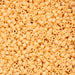 Close-up of beige plastic beads with holes