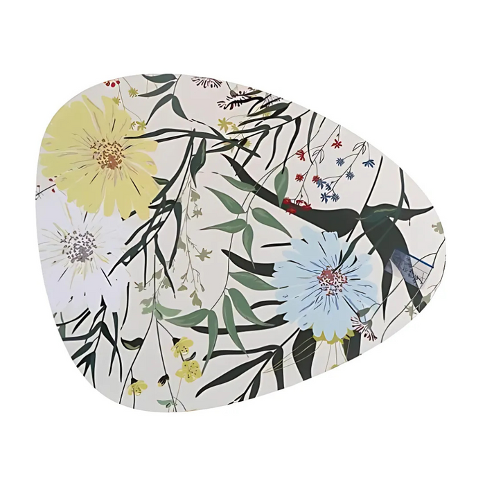Pebble-shaped placemat with daisy and wildflower print in yellow, blue, and green tones.