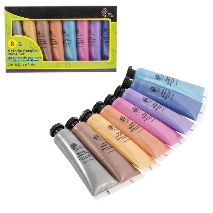 Set of metallic acrylic paint tubes with a box in the background