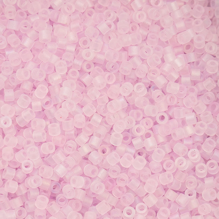Close-up of small pink beads on a pink background