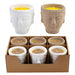 Set of Buddha-shaped candles in a box on a white background