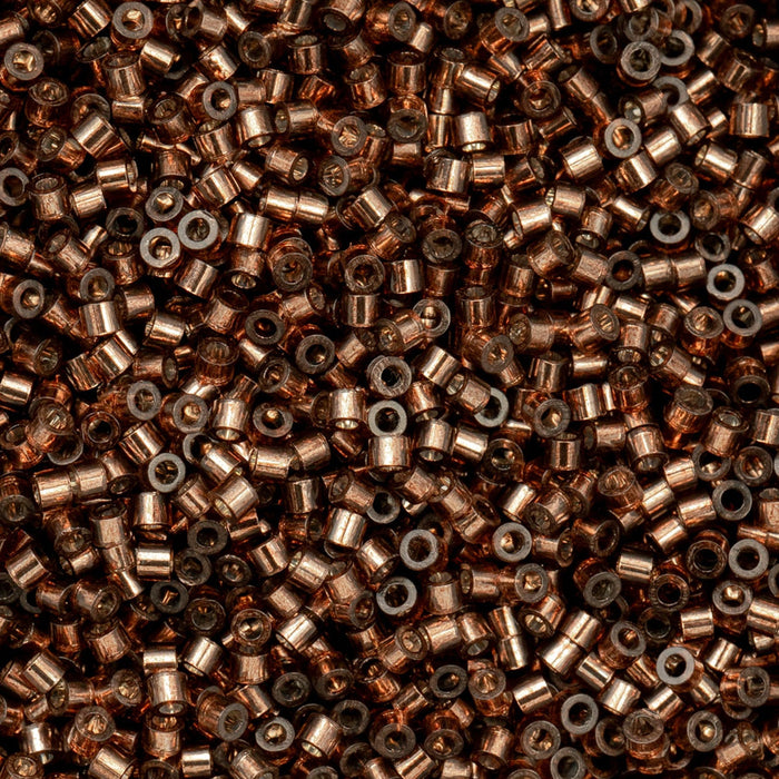 Close-up of small metallic beads in various shades of brown and gray.
