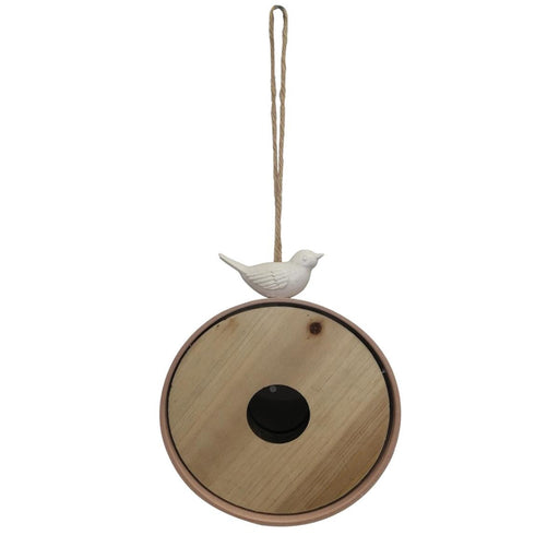 Decorative hanging ornament with a wooden base and white bird figure on a white background