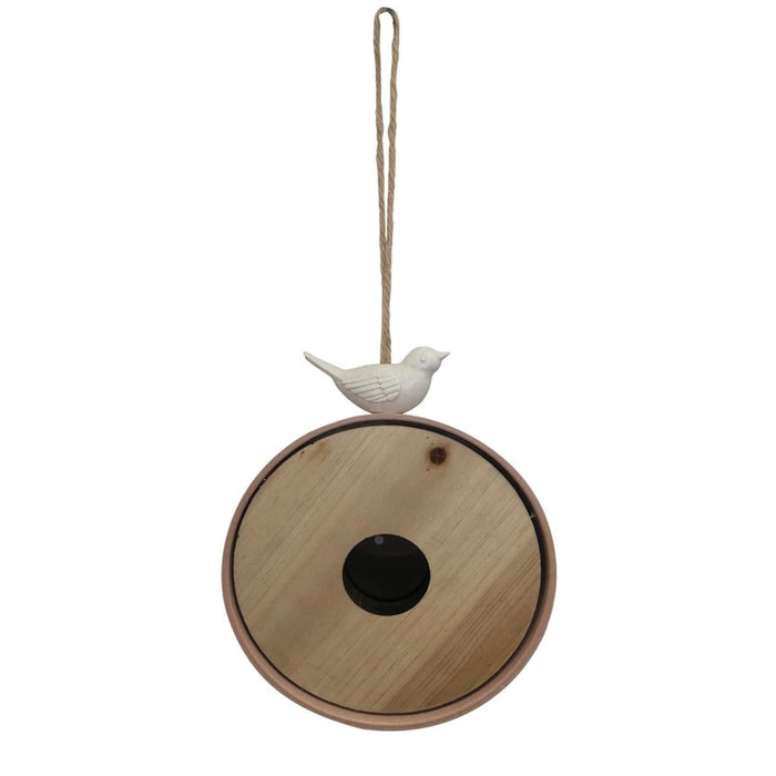 Decorative hanging ornament with a wooden base and white bird figure on a white background