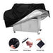 Black grill cover with velcro straps, shrink rope, and storage bag on a white background