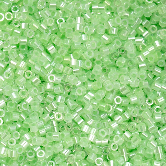 Close-up of small green beads on a green background