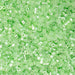 Close-up of small green beads on a green background