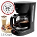 Black coffee maker with a permanent filter included badge, surrounded by coffee and breakfast items.