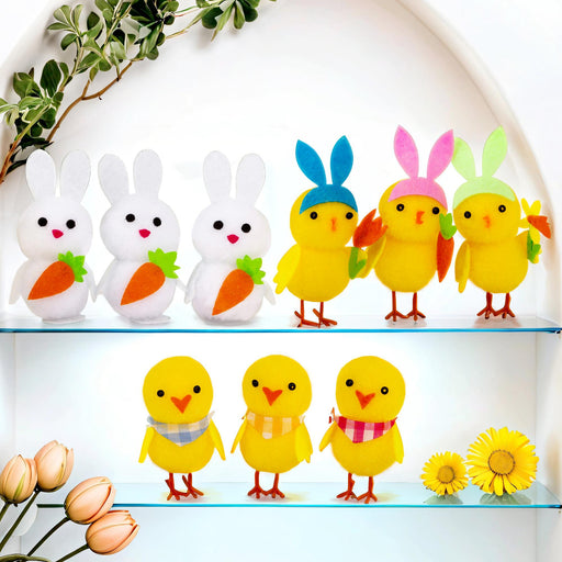 Set of colorful Easter-themed figurines on a decorative shelf with flowers and greenery.