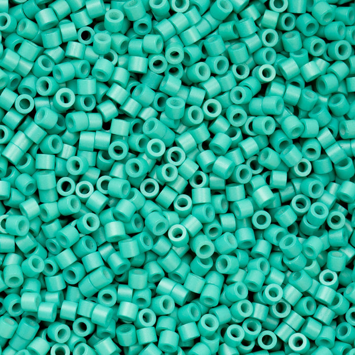 Turquoise plastic beads densely packed together