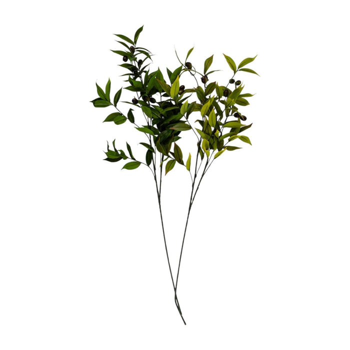 Artificial greenery branch with leaves on a white background