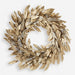 Decorative wreath with gold and silver leaves on a white background