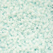 Close-up of light blue plastic beads on a light blue background