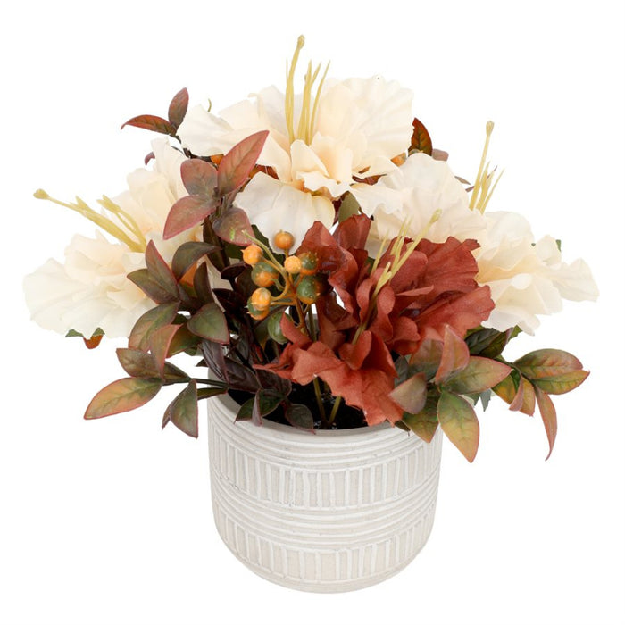 An artificial autumn floral arrangement in a textured white ceramic pot, featuring cream-colored peonies, rust-red calla lilies, and greenish-brown leaves on a white background.