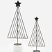 Two minimalist black metal wire Christmas tree decorations with star toppers, displayed on a clean white background with one on a small white pedestal.