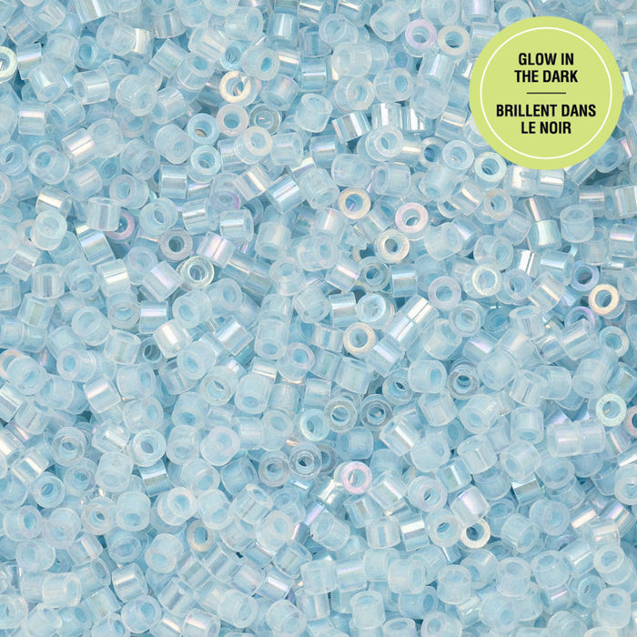 Glow-in-the-dark beads in light blue color with a green label on a blue background