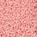 Close-up of pink plastic beads on a pink background
