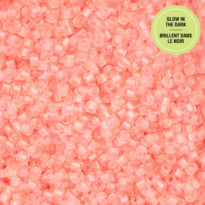 Pink glow-in-the-dark beads with a green label on a pink background