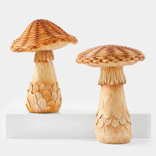 Two decorative mushroom-shaped objects on a white background