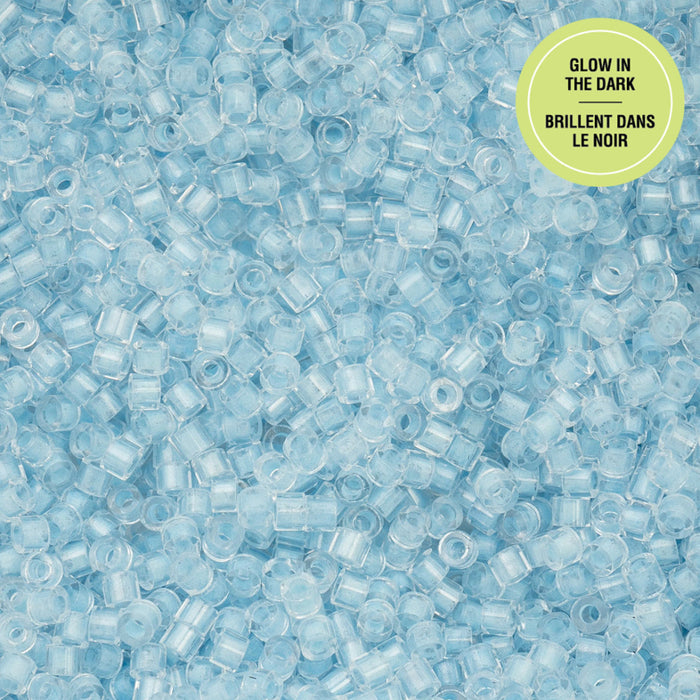 Close-up of blue glow-in-the-dark beads with a label on a blue background