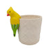 Yellow bird-shaped object on a textured beige pot against a white background