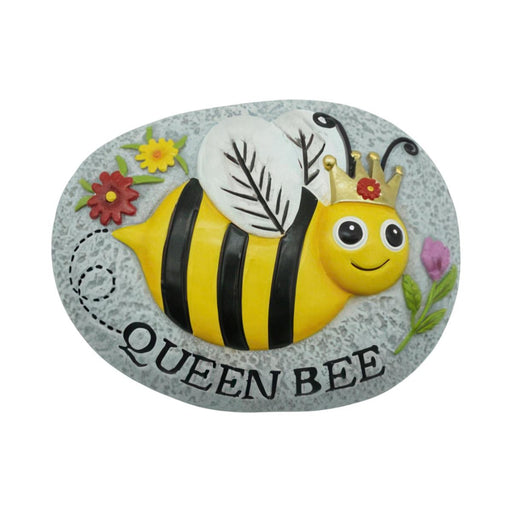 Decorative stone with a cartoon bee design labeled 'Queen Bee' on a white background
