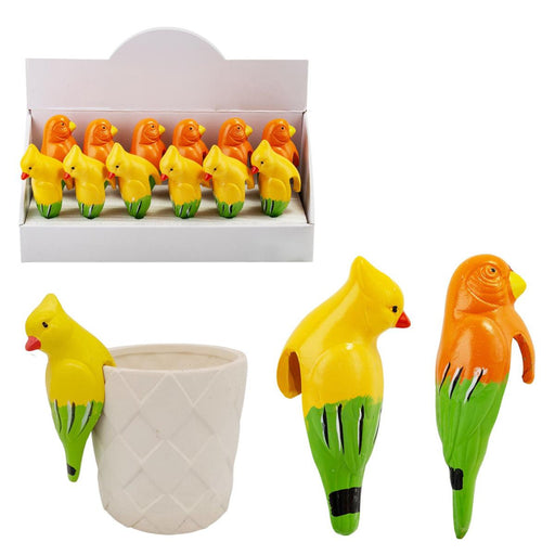 Colorful parrot-shaped items with a box in the background