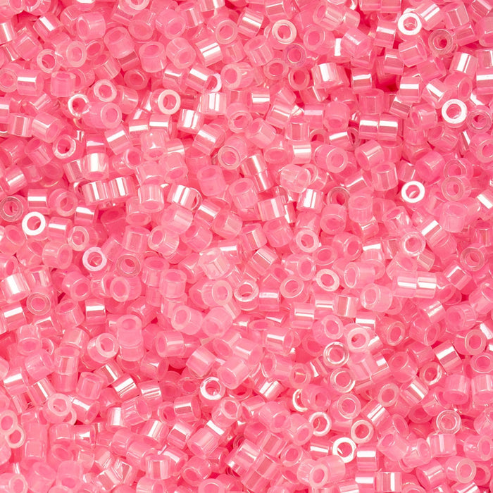 Close-up of pink plastic beads on a pink background