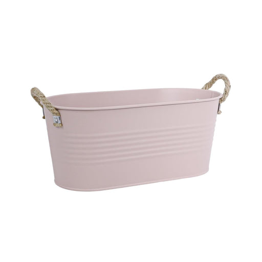Pink metal bathtub with rope handles on a white background