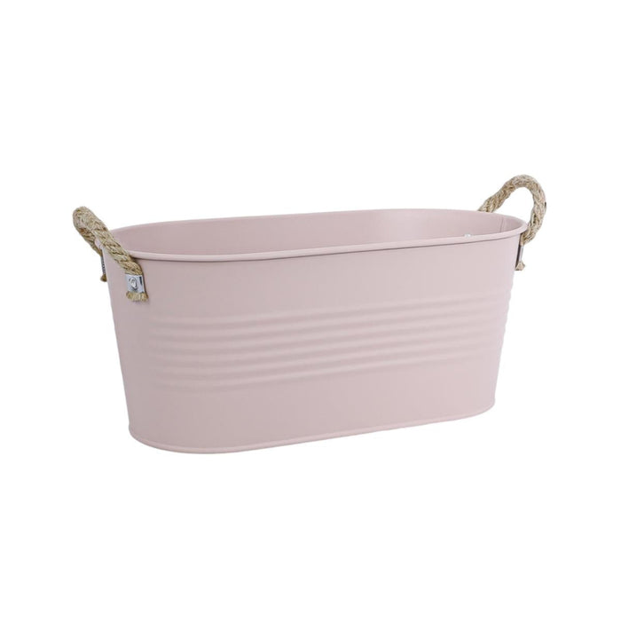 Pink metal bathtub with rope handles on a white background