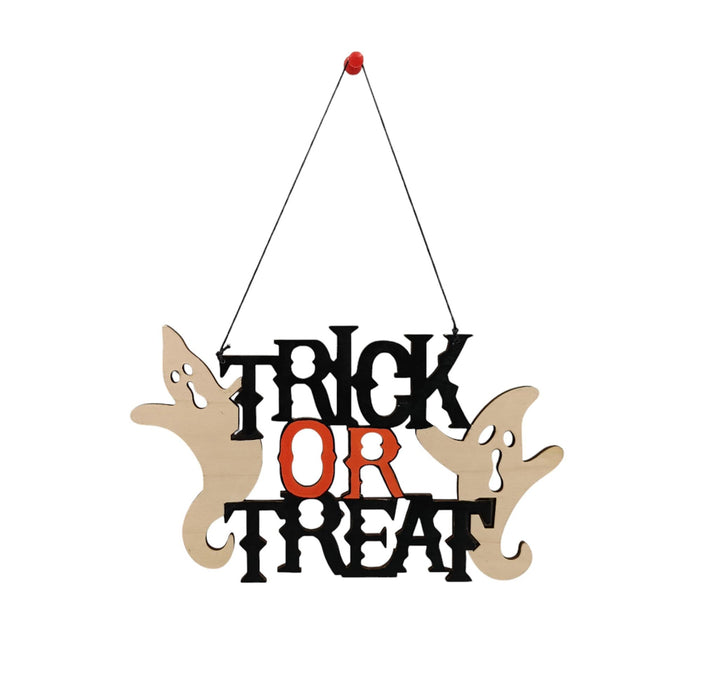 Halloween hanging wall sign reading 'TRICK OR TREAT' in black and orange lettering, with two beige ghost cutouts on either side, suspended by a black string from a small red top.
