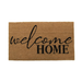 Doormat with 'welcome home' text on a white background