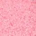 Close-up of pink beads on a pink background