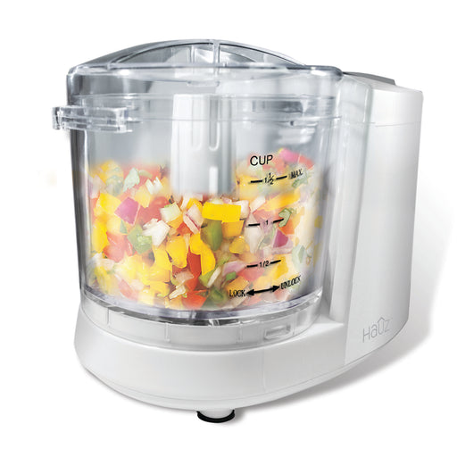 White food chopper with colorful chopped vegetables on a white background