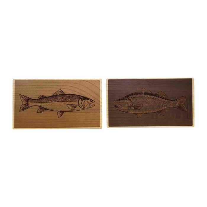 Two wooden coasters with engraved fish designs on a white background