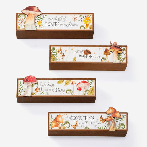 Set of four wooden boxes with mushroom and nature-themed designs on a white background