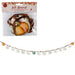 Fall Harvest Hello Pumpkin banner set shown both in its retail packaging and as a loose banner. The package features a floral-patterned header card with autumn leaves and pumpkins, containing a glass bowl wrapped in a brown ribbon.