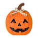 A decorative jack-o'-lantern pumpkin wall hanging with a carved face, orange body, brown stem, and a beige twine bow, shown on a plain white background.