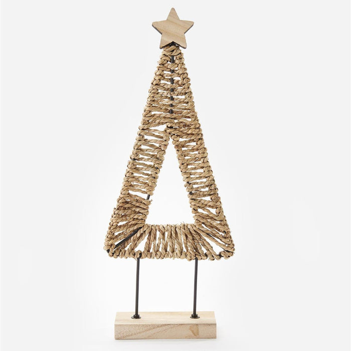 A decorative minimalist Christmas tree sculpture made from woven natural fiber, featuring a star topper and a rectangular wooden base on thin metal legs, shown against a plain light gray background.