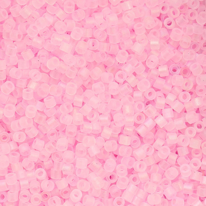 Close-up of small pink beads on a pink background