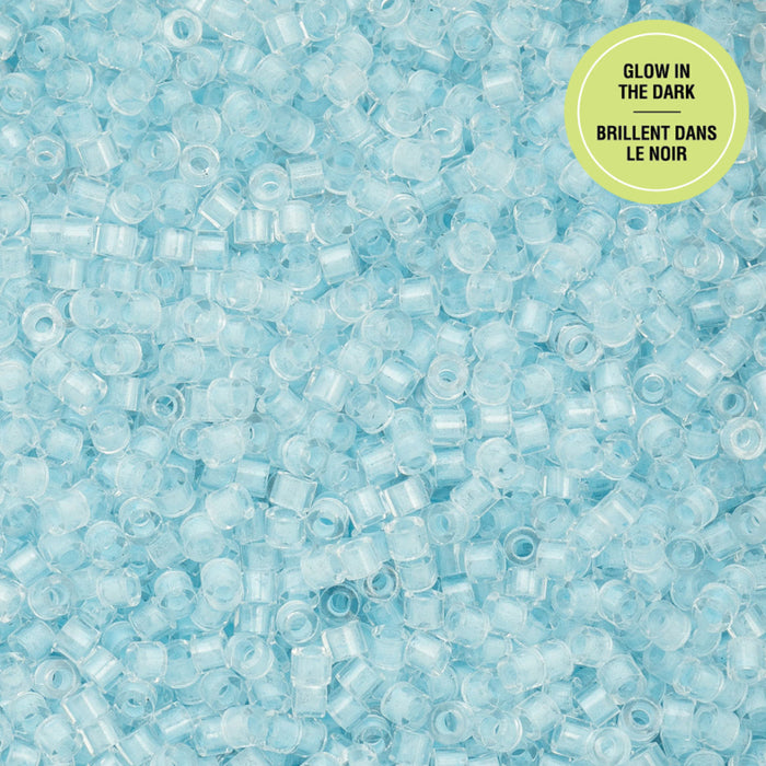 Glow-in-the-dark blue beads with a label on a blue background