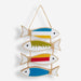 Decorative wall hanging with colorful fish shapes on a white background