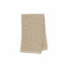 A folded beige bath towel with a textured, raised circular mandala pattern and a ribbed border, shown on a plain white background.