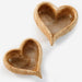 Two heart-shaped ceramic bowls on a white background