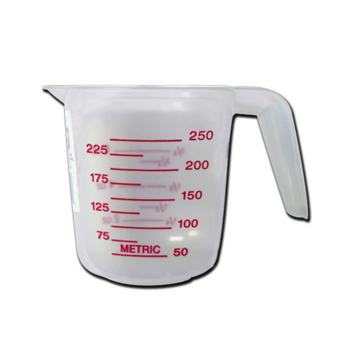 Clear measuring cup with red measurement markings on a white background