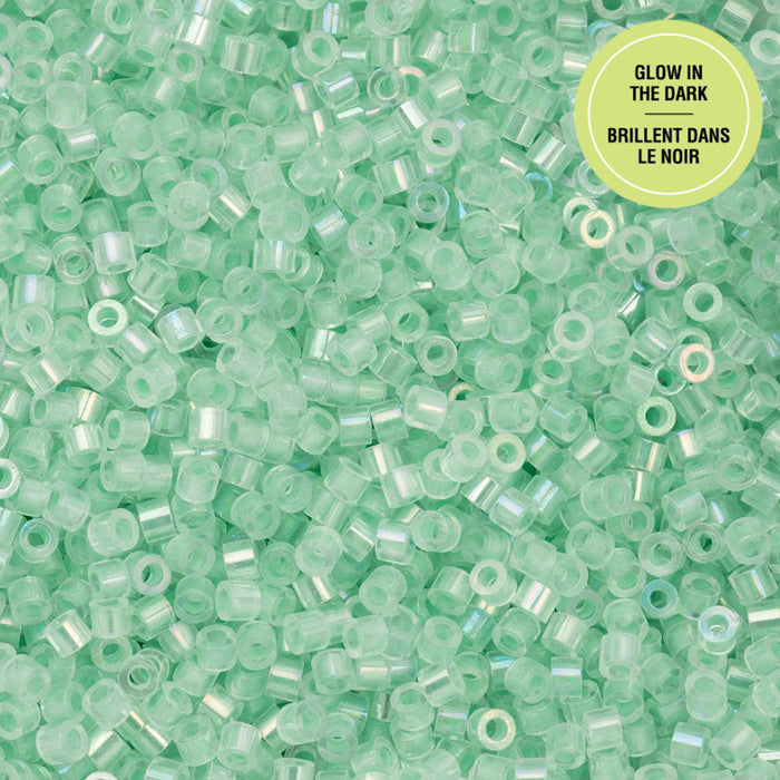 Glow-in-the-dark green beads with a label on a green background