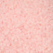 Close-up of light pink beads on a pink background