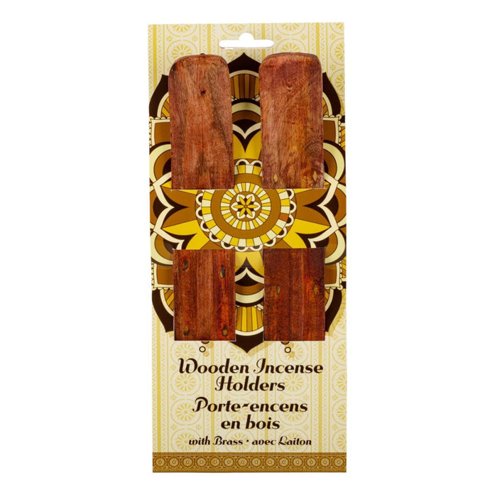 Packaged wooden incense holders with brass accents on a decorative background