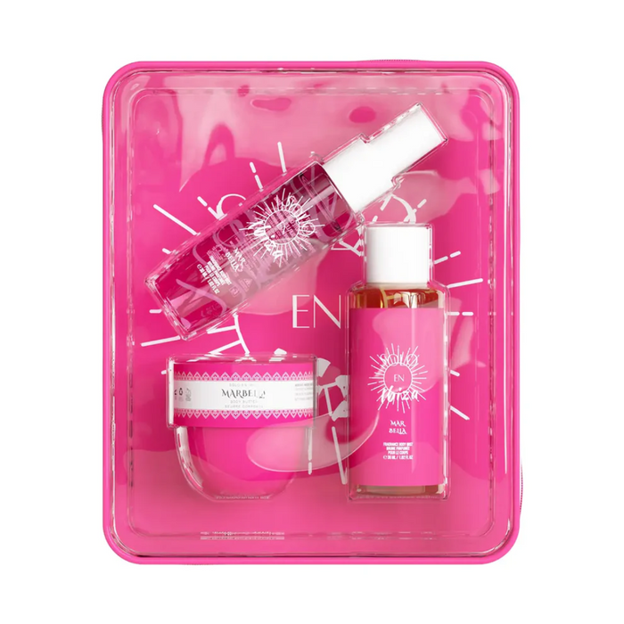 Set of skincare products in a pink packaging tray on a white background