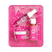 Set of skincare products in a pink packaging tray on a white background